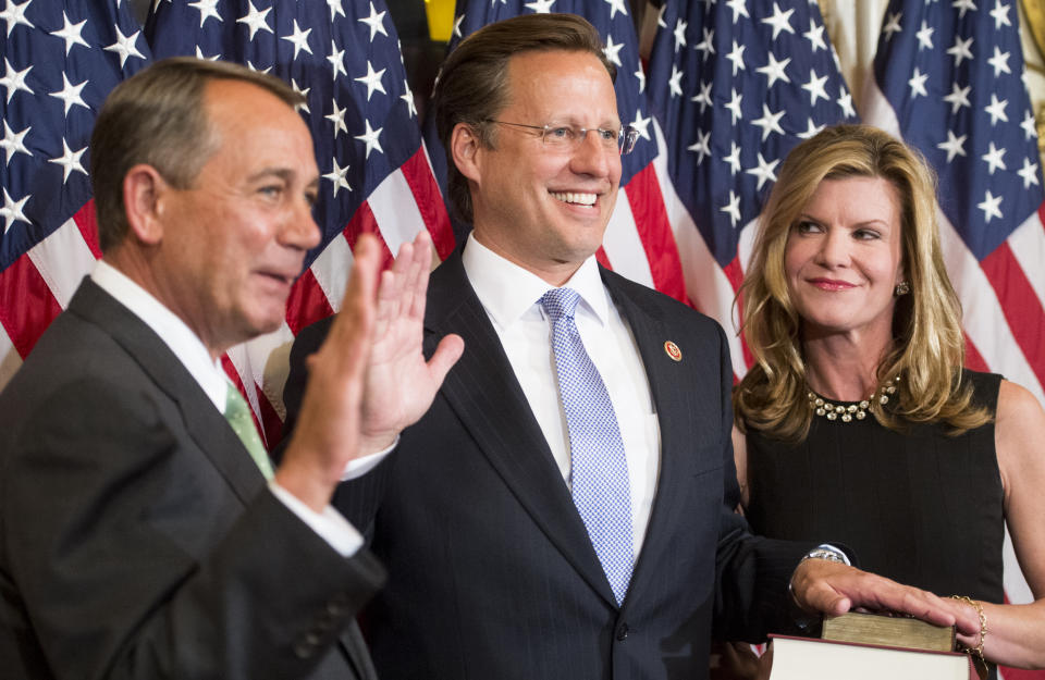 Rep.-elect Dave Brat, R-Va., raises his right hand as his wife Laura looks on during the ceremonial swearing-in photo-op with Speaker of the House John Boehner in the Capitol on Wednesday, Nov. 12, 2014. (Bill Clark/CQ Roll Call via Getty Images)