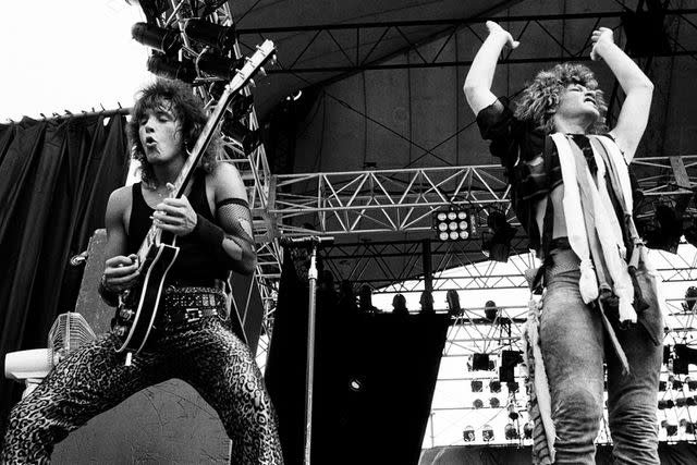 <p>Midori Tsukagoshi/Shinko Music/Getty</p> Richie Sambora and Jon Bon Jovi onstage in 1984