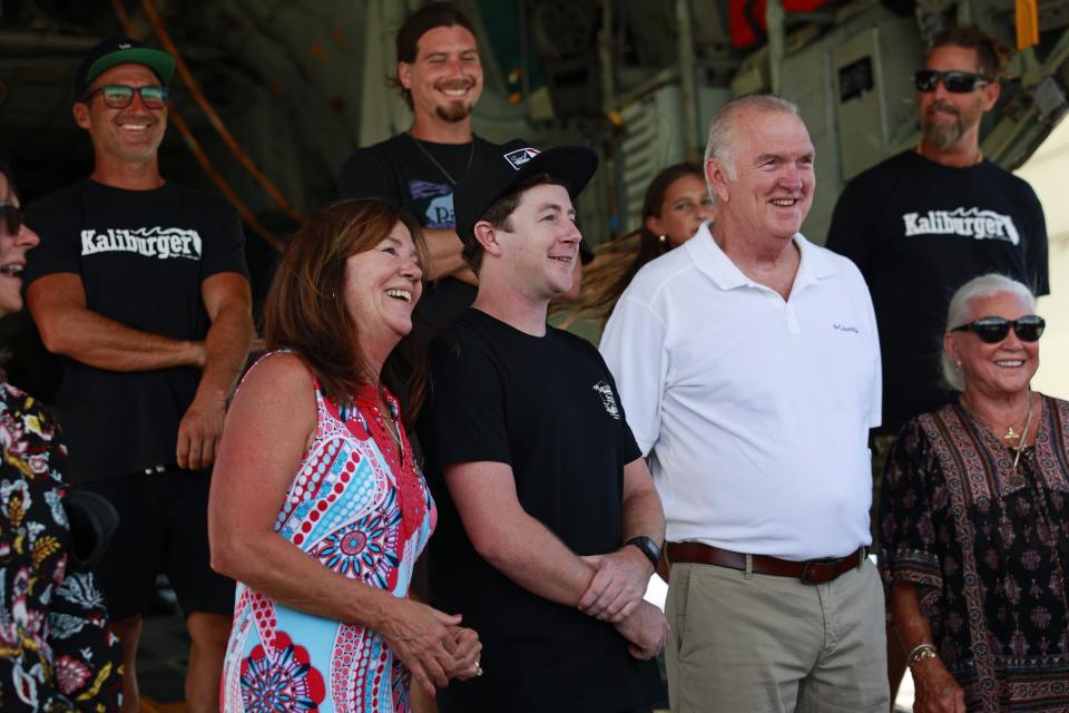 Debra Gregory, Charlie Gregory and Raymond Gregory gather Thursday with those who rescued Charlie from a small boat 12 miles off St. Augustine in August.