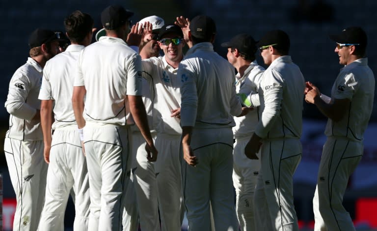 New Zealand celebrate the wicket of England's Alastair Cook on the fourth day of the day-night Test at Eden Park