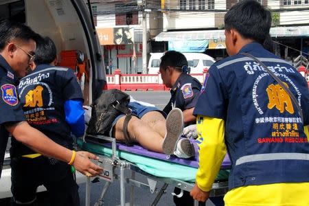 An injured woman is stretchered into an ambulance after two bombs exploded on August 12, 2016 in the Thai seaside resort of Hua Hin, Thailand.Dailynews via REUTERS