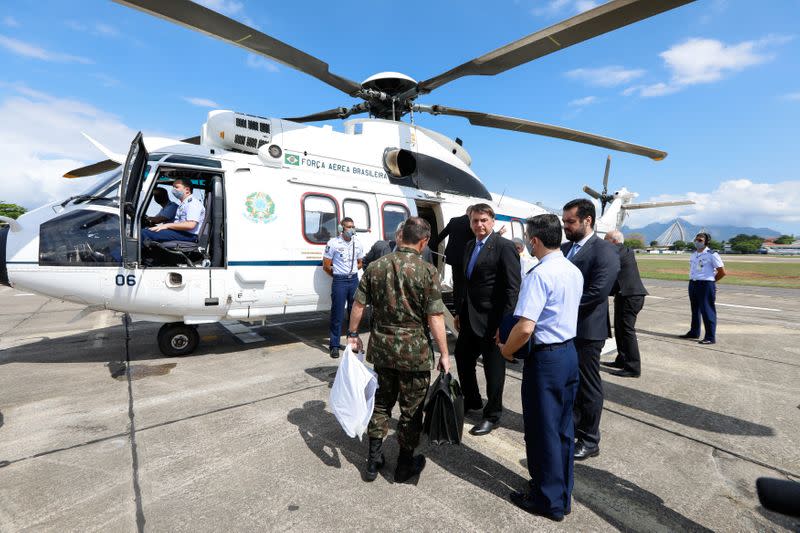 Brazil's President Jair Bolsonaro is seen during his departure to Sao Paulo, where he will undergo a previously scheduled operation, at the Airbase of Galeao in Rio de Janeiro