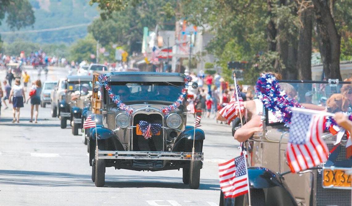 Members of the Ford Model A Club drive down Main Street in Templeton during a Fourth of July parade.