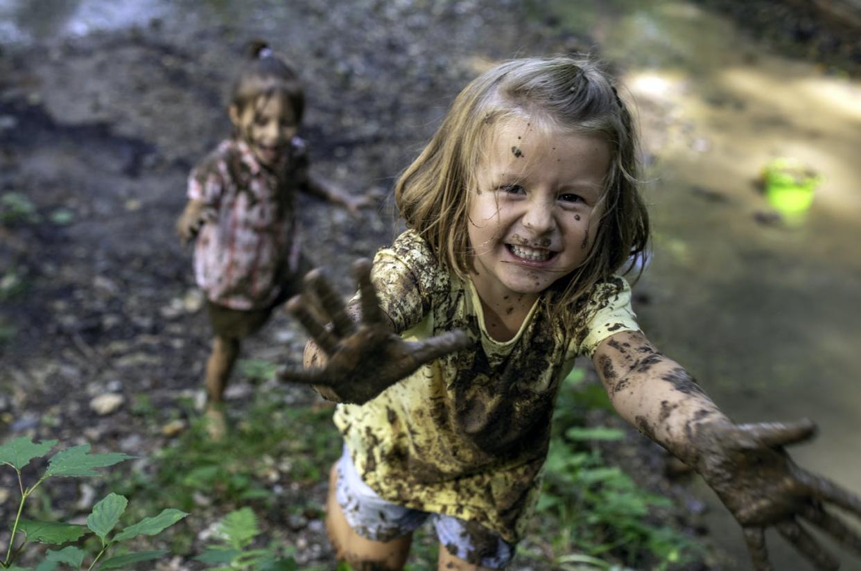 <span class="caption">Stain-resistance can mean questionable chemicals in children's clothes.</span> <span class="attribution"><a class="link " href="https://www.gettyimages.com/detail/photo/smiling-little-muddy-girl-royalty-free-image/1059735838" rel="nofollow noopener" target="_blank" data-ylk="slk:VM via Getty Images;elm:context_link;itc:0;sec:content-canvas">VM via Getty Images</a></span>