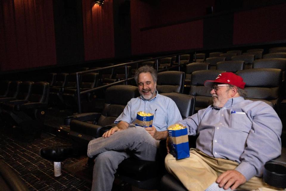 Larry Toppman, left, and Tim Funk — photographed this summer at Independent Picture House in NoDa — started going to movies together in the 1990s as colleagues at The Charlotte Observer ... and have continued to frequent local theaters as pals since retiring from their reporting jobs in the 2010s.