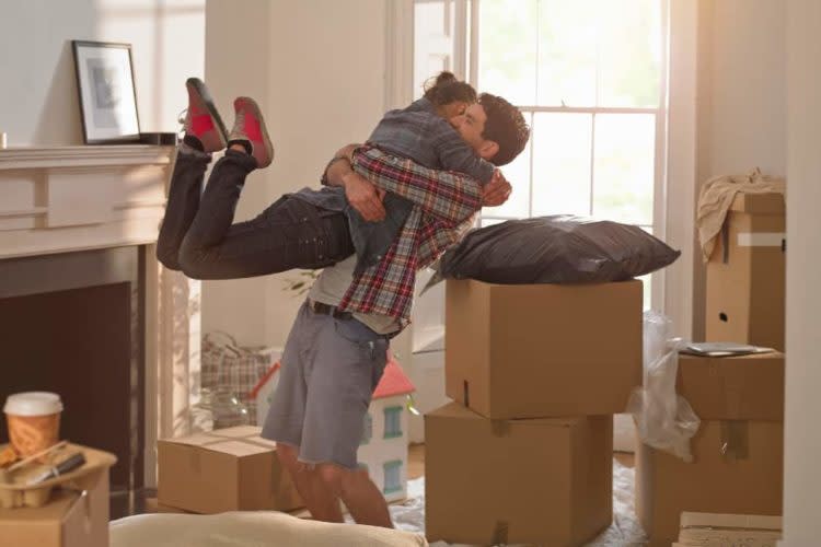 A couple celebrating moving in to a new home