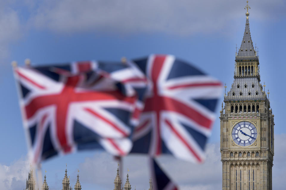 Union Jack flags are seen in front of the Elizabeth Tower, known as Big Ben, beside the Houses of Parliament in London, Friday, June 24, 2022. British Prime Minister Boris Johnson suffered a double blow as voters rejected his Conservative Party in two special elections dominated by questions about his leadership and ethics. He was further wounded when the party's chairman quit after the results came out early Friday, saying Conservatives “cannot carry on with business as usual.” (AP Photo/Frank Augstein)