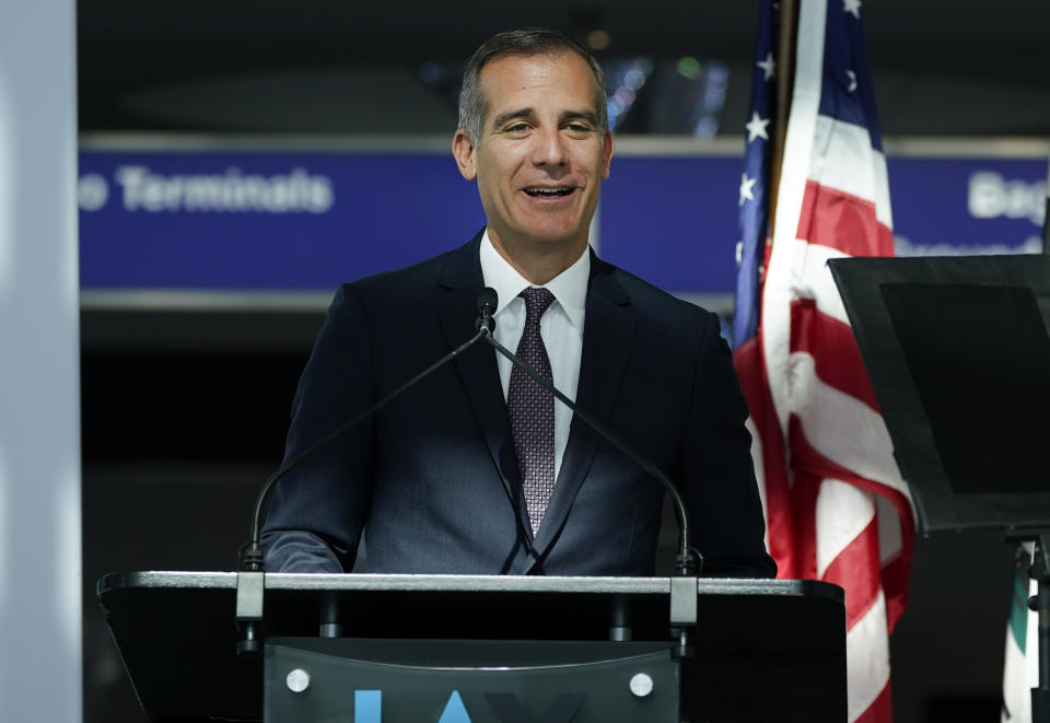 FILE - In this May 24, 2021, file photo, Los Angeles Mayor Eric Garcetti speaks at a news conference at Los Angeles International Airport, in Los Angeles. Los Angeles Mayor Eric Garcetti, who is on a trip to the UN climate conference in Scotland, tested positive for COVID-19 on Wednesday, Nov. 3, 2021, his office said in a posting on his official Twitter account. "He is feeling good and isolating in his hotel room. He is fully vaccinated," his office said in a tweet. (AP Photo/Ashley Landis, File)