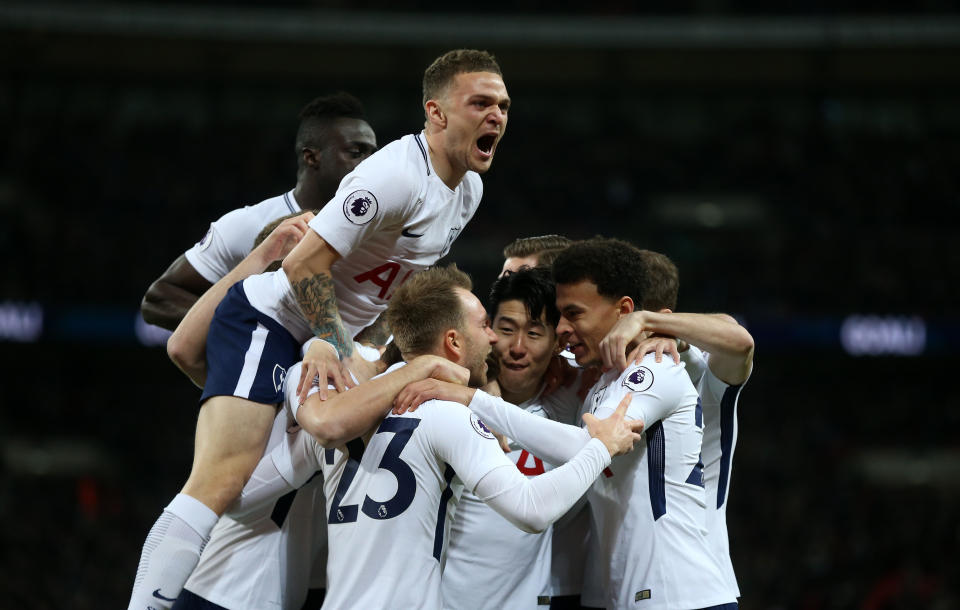 Tottenham celebrates Christian Eriksen’s opening-minute goal against Manchester United on Wednesday. (Getty)