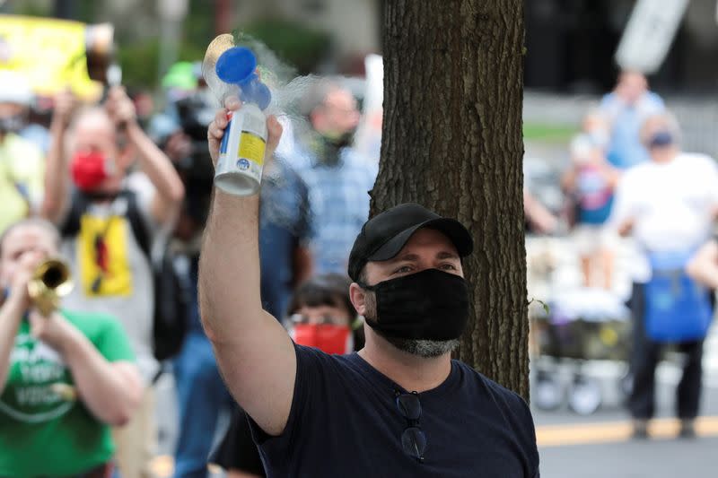 Demonstration outside of the condo of Postmaster General Louis DeJoy, in Washington