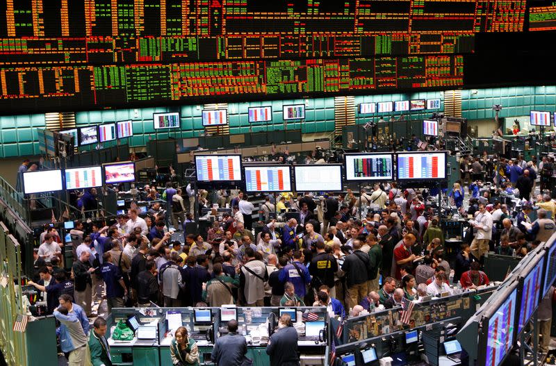 FILE PHOTO: Traders work in the oil options pit of the New York Mercantile Exchange