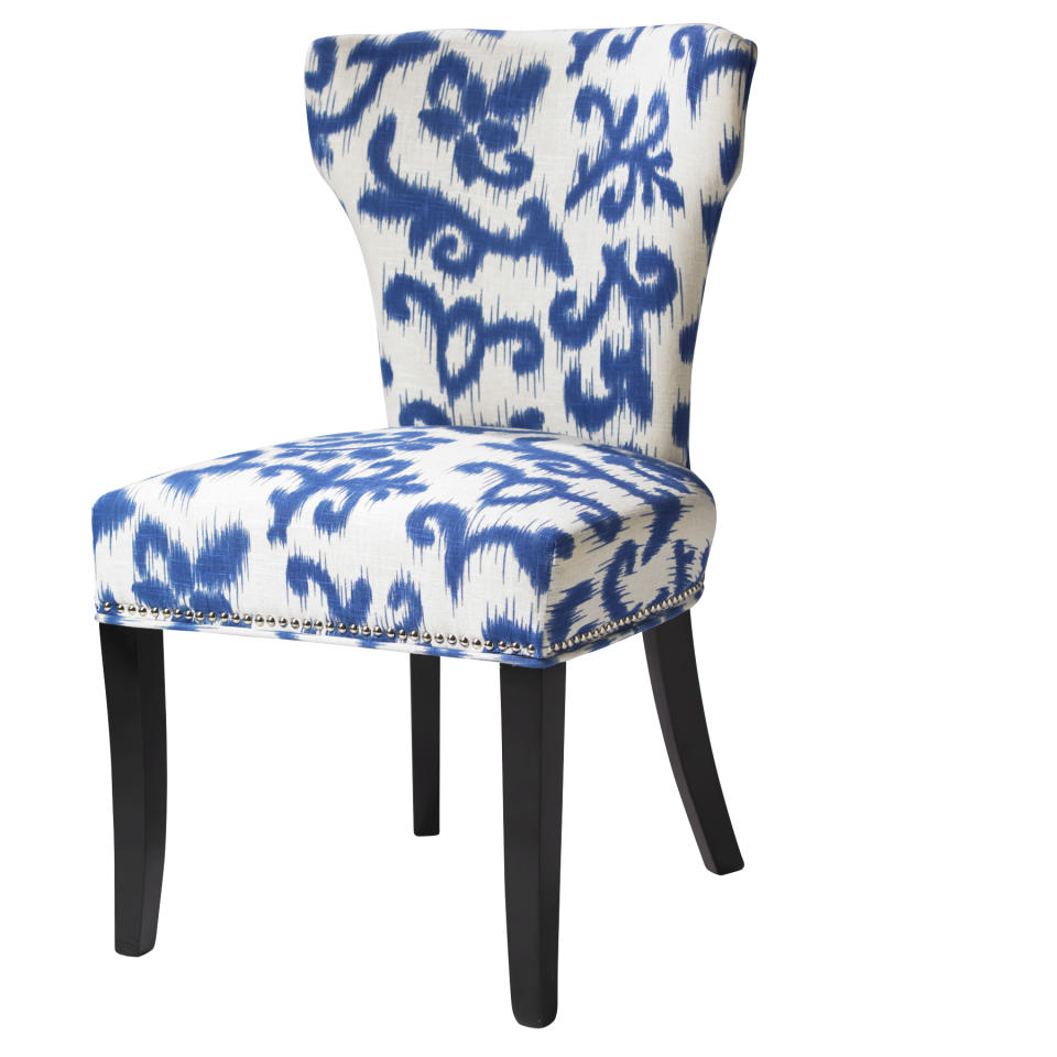 This undated publicity photo provided by HomeGoods shows an upholstered chair in a blue and white print from HomeGoods (www.homegoods.com). Blue and white prints are a big trend this spring. (AP Photo/HomeGoods)