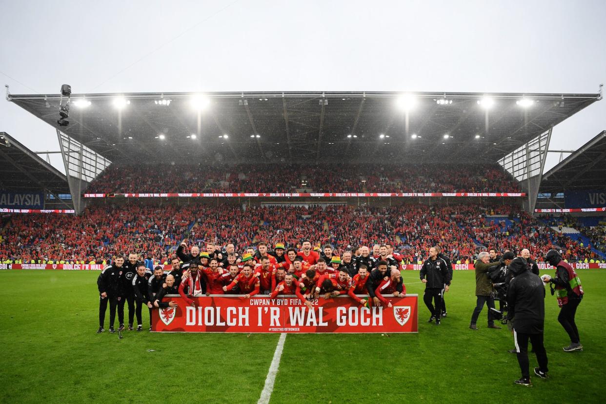 Players and staff of Wales celebrate during the 2022 FIFA World Cup Qualifier play-off Final match between Wales and Ukraine at Cardiff City Stadium