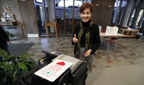 Iowa Gov. Kim Reynolds reacts after casting her ballot in the general election, Tuesday, Nov. 6, 2018, at the United Methodist Church in Osceola, Iowa. (AP Photo/Charlie Neibergall)