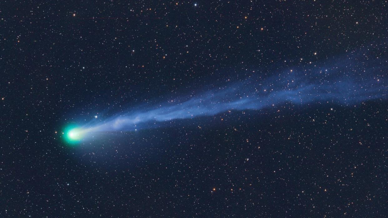  A bright green comet with a long tail. 