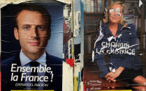 <p>Electoral posters show centrist candidate Emmanuel Macron, left, and a defaced poster of far-right candidate Marine Le Pen, Wednesday May 3, 2017 in Marseille, southern France. Pro-European progressive Emmanuel Macron and far-right Marine Le Pen are facing off today in their only direct debate before Sunday’s presidential runoff election. (AP Photo/Claude Paris) </p>