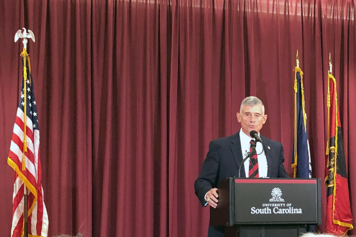 FILE - In this July 22, 2019 file photo New University of South Carolina President Bob Caslen answers questions from reporters in Columbia, S.C. The University of South Carolina will not be punished by a group that accredits colleges. The university had been accused of allowing outside political forces to influence trustees when they picked Caslen as the school's new president last summer. The Southern Association of Colleges and Schools says it will continue to monitor the university. Gov. Henry McMaster pressured trustees to pick Caslen after they voted to restart the presidential search. McMaster is by law a ex-officio trustee complicating his political influence. On Tuesday, Dec. 10, 2019 McMaster says the accreditation decision means it's time to move on from the controversy. (AP Photo/Jeffrey Collins)