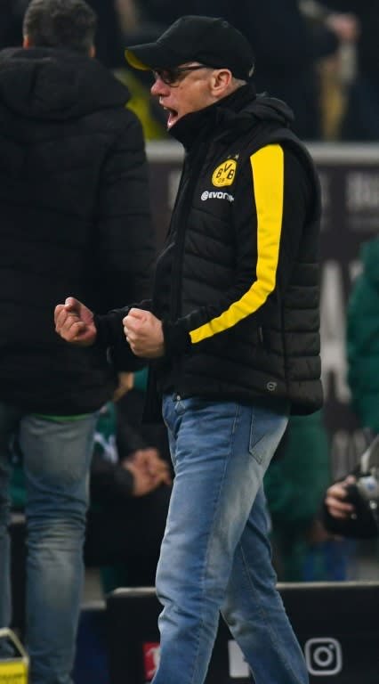 Day of delight: Dortmund coach Peter Stoeger celebrates the winning goal