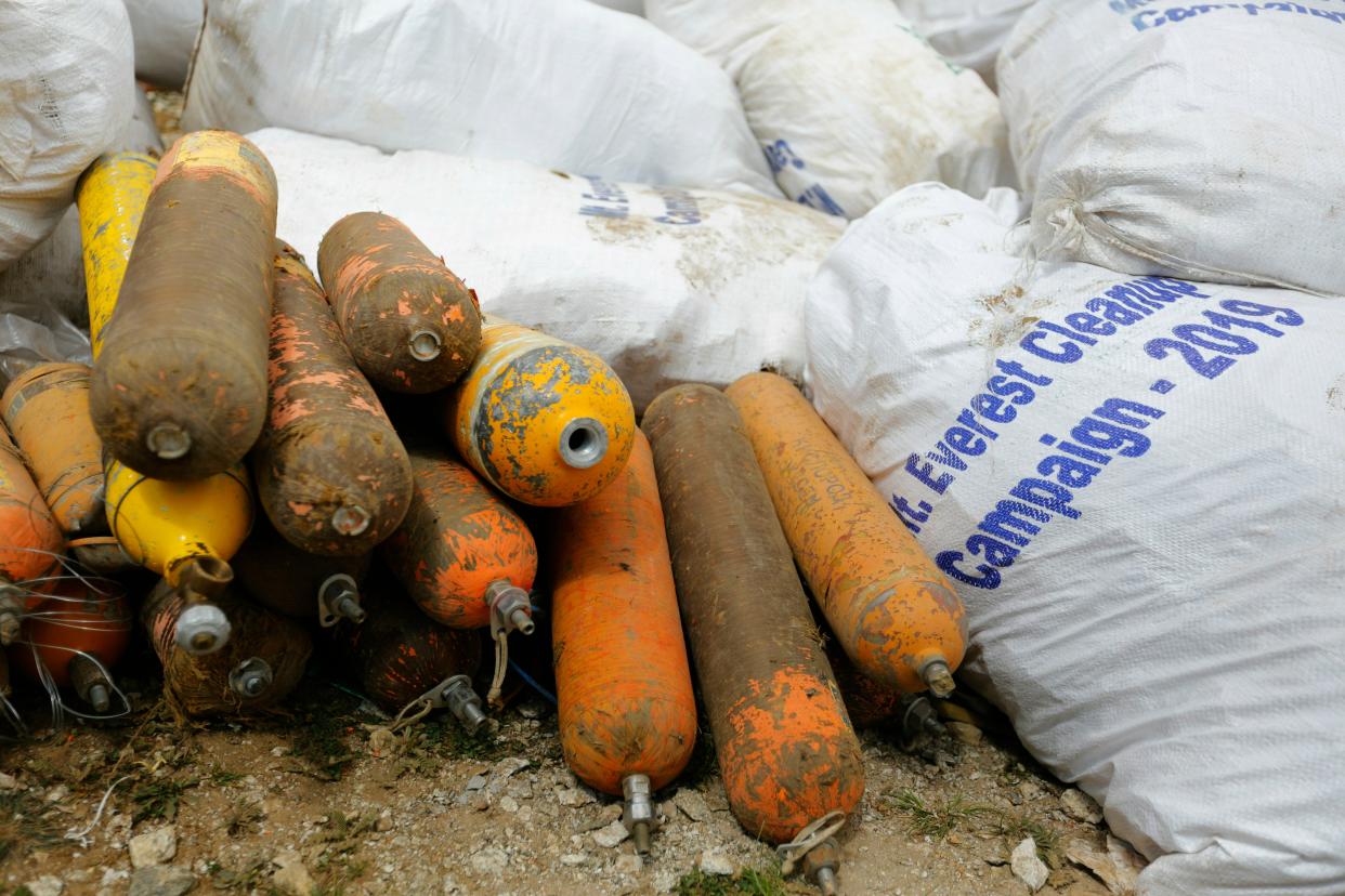 Empty oxygen cylinders are seen after they were collected from Mount Everest on May 27, 2019.