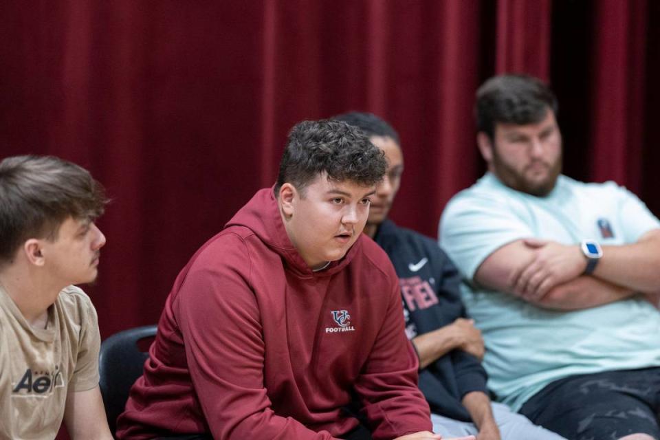 Recent Harlan County High School graduate Mason Beach, second from left, is photographed at the school in Harlan, Ky., on Wednesday, May 8, 2024.