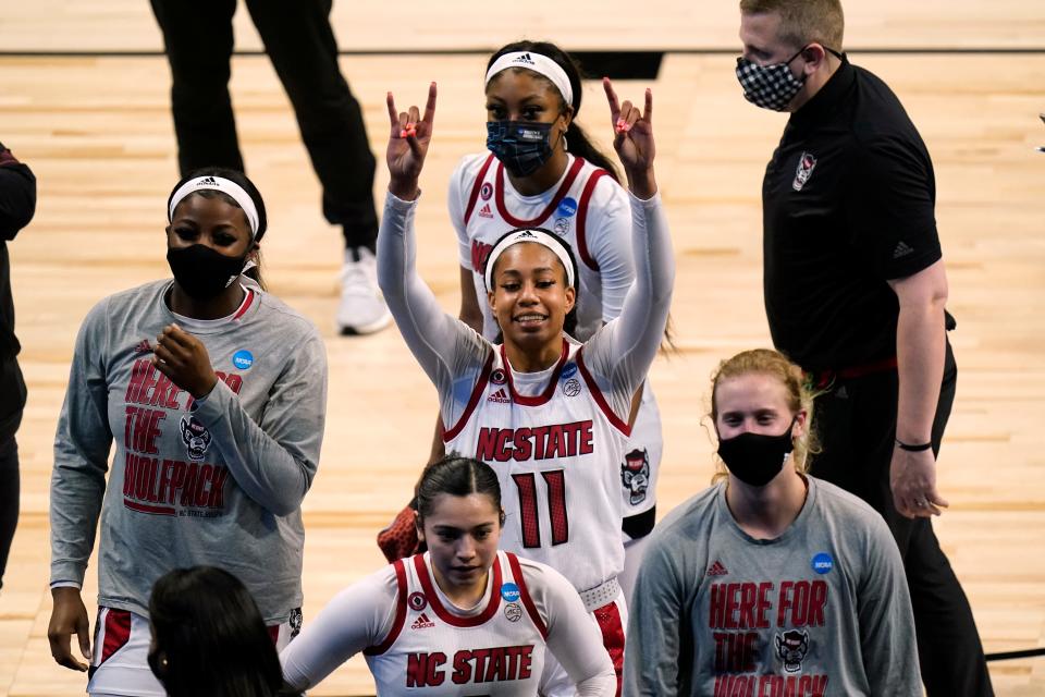 North Carolina State forward Jakia Brown-Turner (11) walks off the court with teammates after a college basketball game against South Florida in the second round of the women's NCAA tournament at the Alamodome in San Antonio, Tuesday, March 23, 2021. North Carolina State won 79-67.