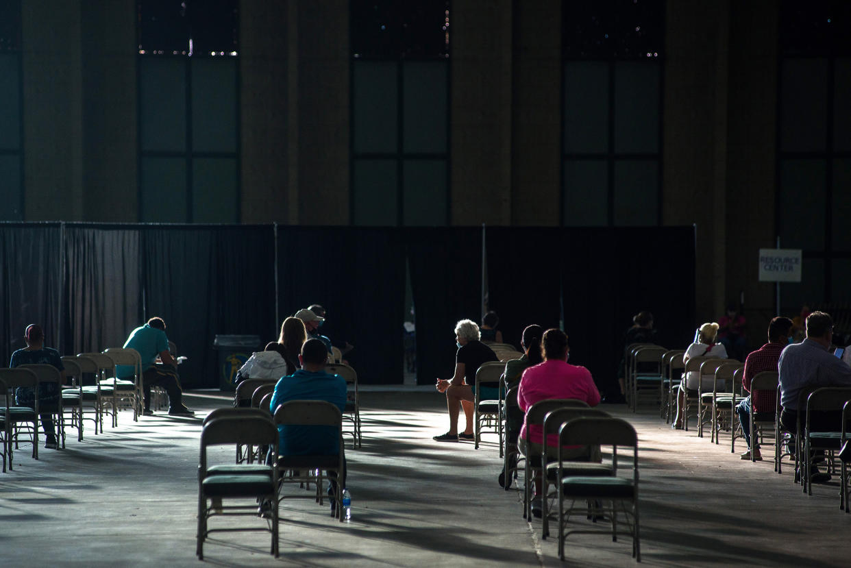 People await help with unemployment claims at an event in Tulsa, Okla., on July 24