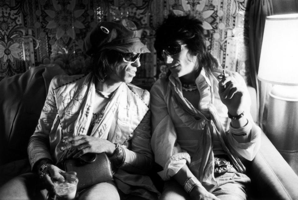 <p>Keith Richards and Ron Wood of the Rolling Stones chat on their plane while on tour in 1975. </p>