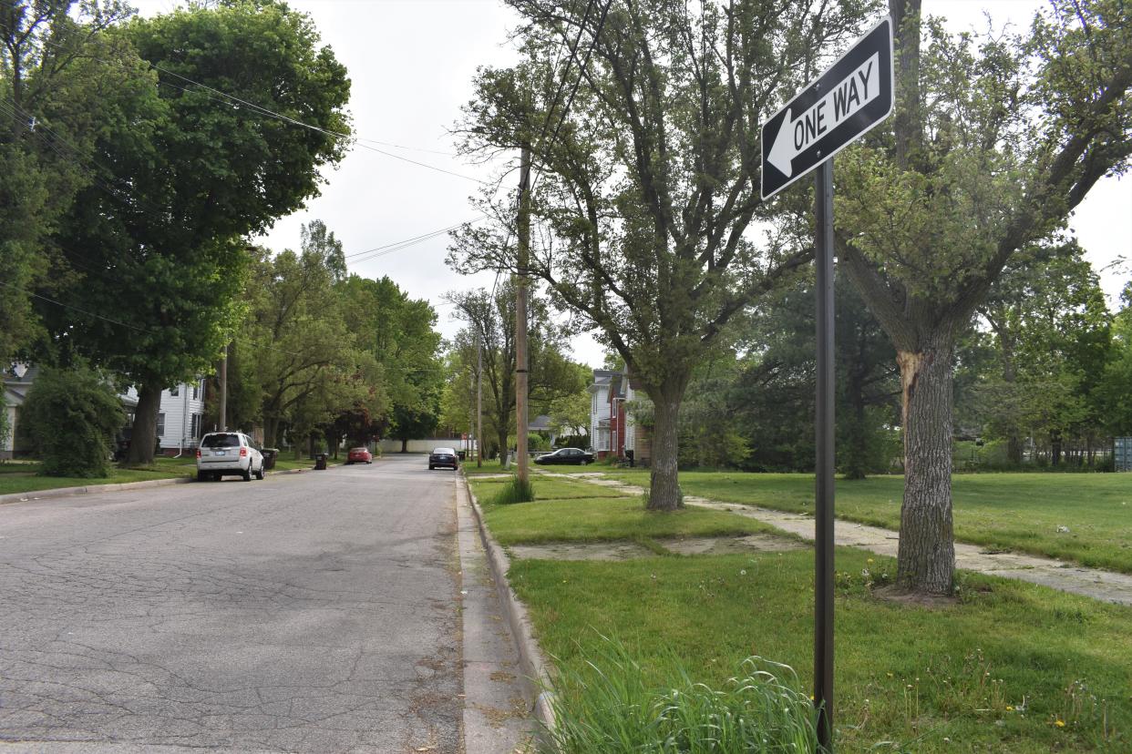 A "one way" sign is pictured Tuesday along Cross Street in Adrian. The city of Adrian is looking into the possibility of converting Cross Street into a two-way street. It currently connects South Main and South Winter streets.