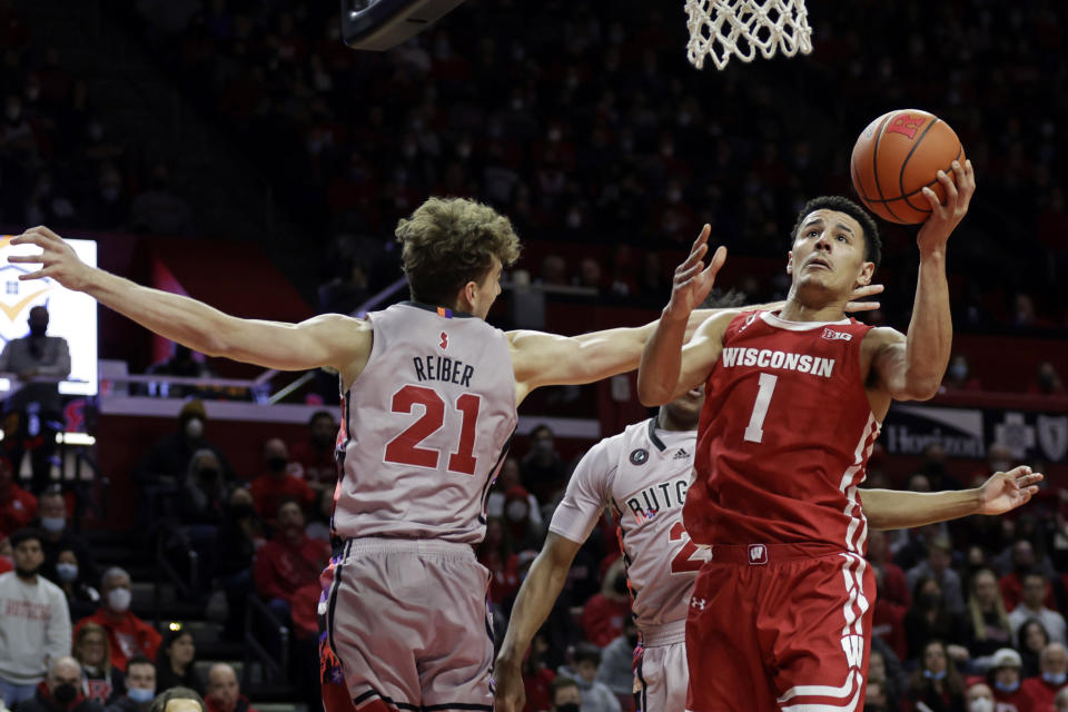 Wisconsin guard Johnny Davis (1) drives to the basket past Rutgers forward Dean Reiber (21) during the first half of an NCAA college basketball game Saturday, Feb. 26, 2022, in Piscataway, N.J. (AP Photo/Adam Hunger)