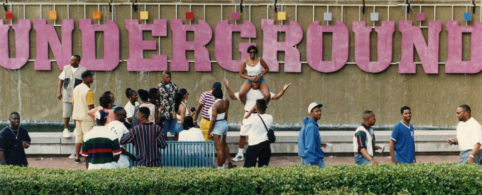 Freaknik visitors get their photos taken outside the sign of Underground in downtown Atlanta, April 23, 1994. (AP Photo/Atlanta Journal-Constitution, Marlene Karas) MARIETTA DAILY OUT; GWINNETT DAILY POST OUT; LOCAL BROADCAST OUT (WXIA, WGCL, Fox 5)