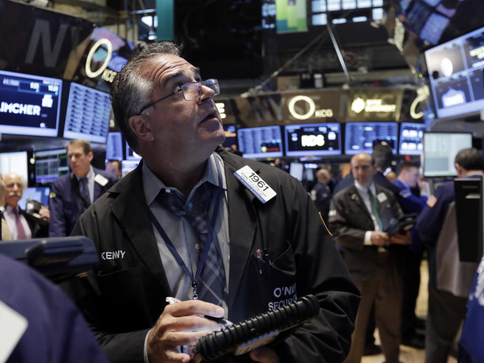 Trader Kenneth Polcari works on the floor of the New York Stock Exchange Thursday, March 13, 2014. Stocks opened higher as traders were encouraged by a pickup in retail sales and more signs of health in the U.S. job market. (AP Photo/Richard Drew)