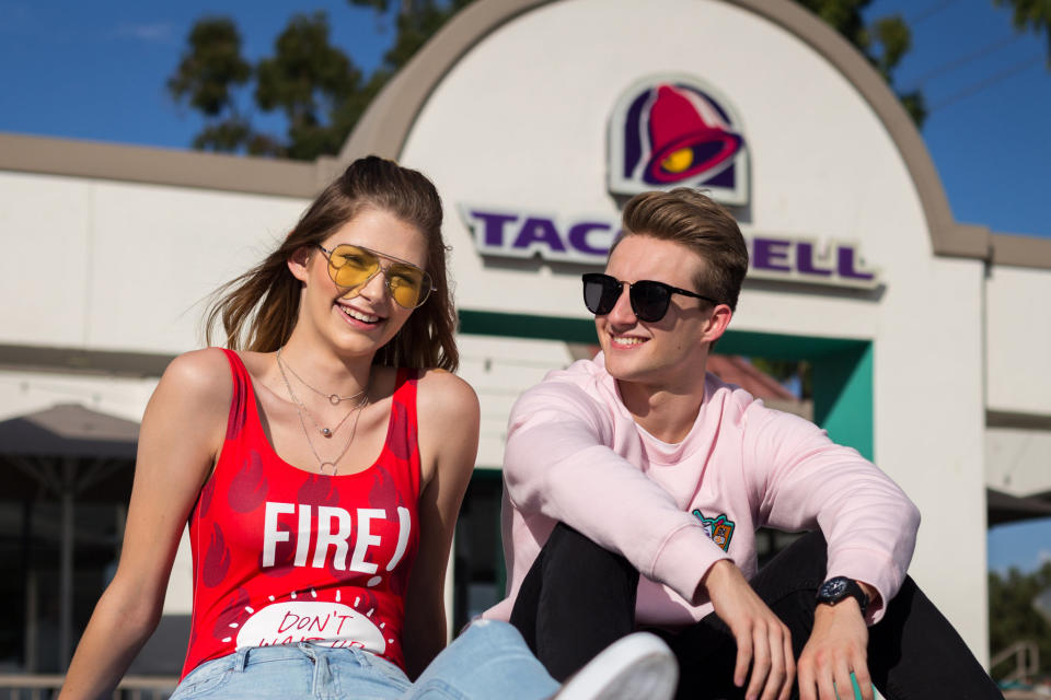 Models for the new <a href="http://www.refinery29.com/2017/09/174135/taco-bell-forever-21-collaboration" target="_blank">Forever 21 x Taco Bell collection</a> include <a href="https://www.huffingtonpost.com/entry/teen-gets-her-senior-photos-taken-at-taco-bell_us_55c8a478e4b0f73b20b9d3bb" target="_blank">Brittany Creech</a> and <a href="https://www.huffingtonpost.com/entry/taco-bell-senior-portraits_us_5925c86de4b0650cc0213ed2">Andrew McBurnie</a>, both of whom <a href="https://www.huffingtonpost.com/entry/teen-gets-her-senior-photos-taken-at-taco-bell_us_55c8a478e4b0f73b20b9d3bb">famously took their senior portraits</a> at Taco Bell. (Photo: Taco Bell)