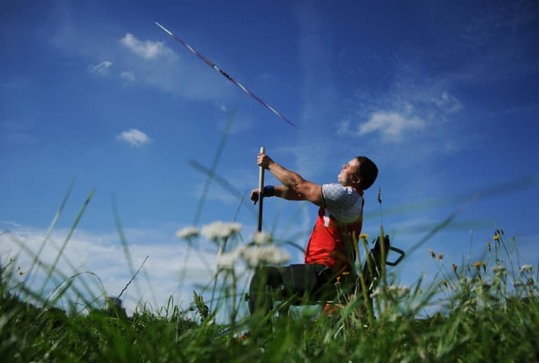 Belarus' Paralympic athlete Alexander Triput throws a javelin during a training session