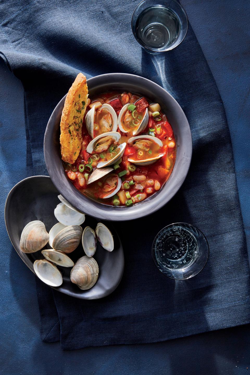 <p>The classic Spanish combination of briny littleneck clams—the smallest and most tender of the clam clan—smoky chorizo, and tender white beans come together in seamless soup harmony. Turn this liquid lunch into a robust meal with our quick and easy garlic bread—perfect for sopping up every last drop.</p> <p><a href="https://www.myrecipes.com/recipe/spicy-clam-chorizo-white-bean-soup" rel="nofollow noopener" target="_blank" data-ylk="slk:Spicy Clam, Chorizo, and White Bean Soup Recipe;elm:context_link;itc:0;sec:content-canvas" class="link ">Spicy Clam, Chorizo, and White Bean Soup Recipe</a></p>