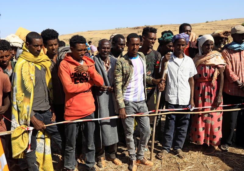 Ethiopians receive supplies at the Um-Rakoba camp on the Sudan-Ethiopia border