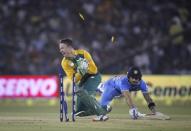 India's Virat Kohli dives to make the crease as he is run out by South Africa's AB de Villiers during their second Twenty20 cricket match in Cuttack, India, October 5, 2015. REUTERS/Danish Siddiqui