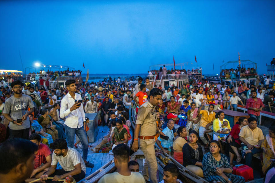 Attendees watch the Ganga Aarti evening ritual at Dashashwamedh Ghat in Varanasi, India, on Saturday, June 24, 2023. Scientists estimate climate change has made extreme heat 30 times more likely in India, and the World Bank has flagged India is likely to be one of the first places in the world where heat waves breach the human survivability threshold.<span class="copyright">Prashanth Vishwanathan-Bloomberg</span>