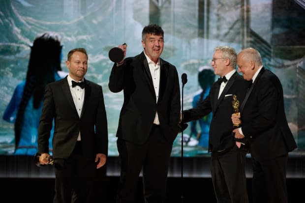 <em>L-R: Richard Baneham, </em>Eric Saindon, Daniel Barrett, and Joe Letteri accept the Oscar® for Visual Effects during the live ABC telecast of the 95th <a href="https://parade.com/movies/oscars-2023-academy-awards" rel="nofollow noopener" target="_blank" data-ylk="slk:Oscars;elm:context_link;itc:0;sec:content-canvas" class="link ">Oscars</a>® at the Dolby® Theatre at Ovation Hollywood on Sunday, March 12, 2023.<p>Blaine Ohigashi / ©A.M.P.A.S.</p>