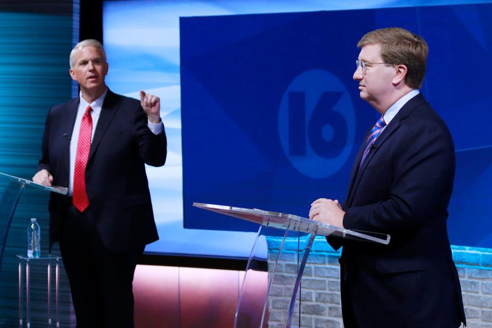 Brandon Presley, the Democratic nominee for governor, left, debates with Republican Mississippi Gov. Tate Reeves during a televised gubernatorial debate Wednesday, Nov. 1, 2023, in Jackson.