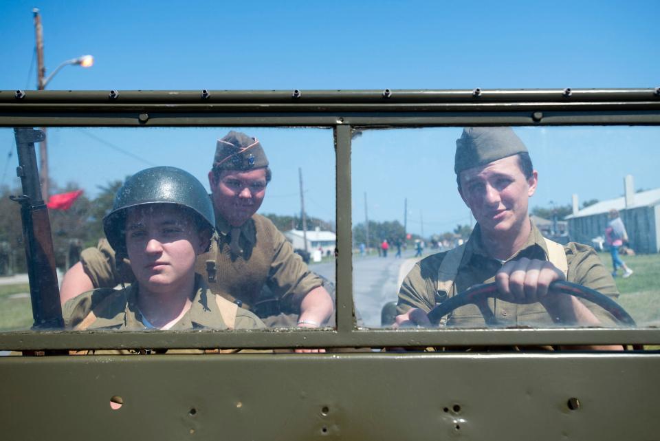 United States Army reenactors cruise around Fort Miles in a WWII era Jeep in Cape Henlopen State Park in Lewes.