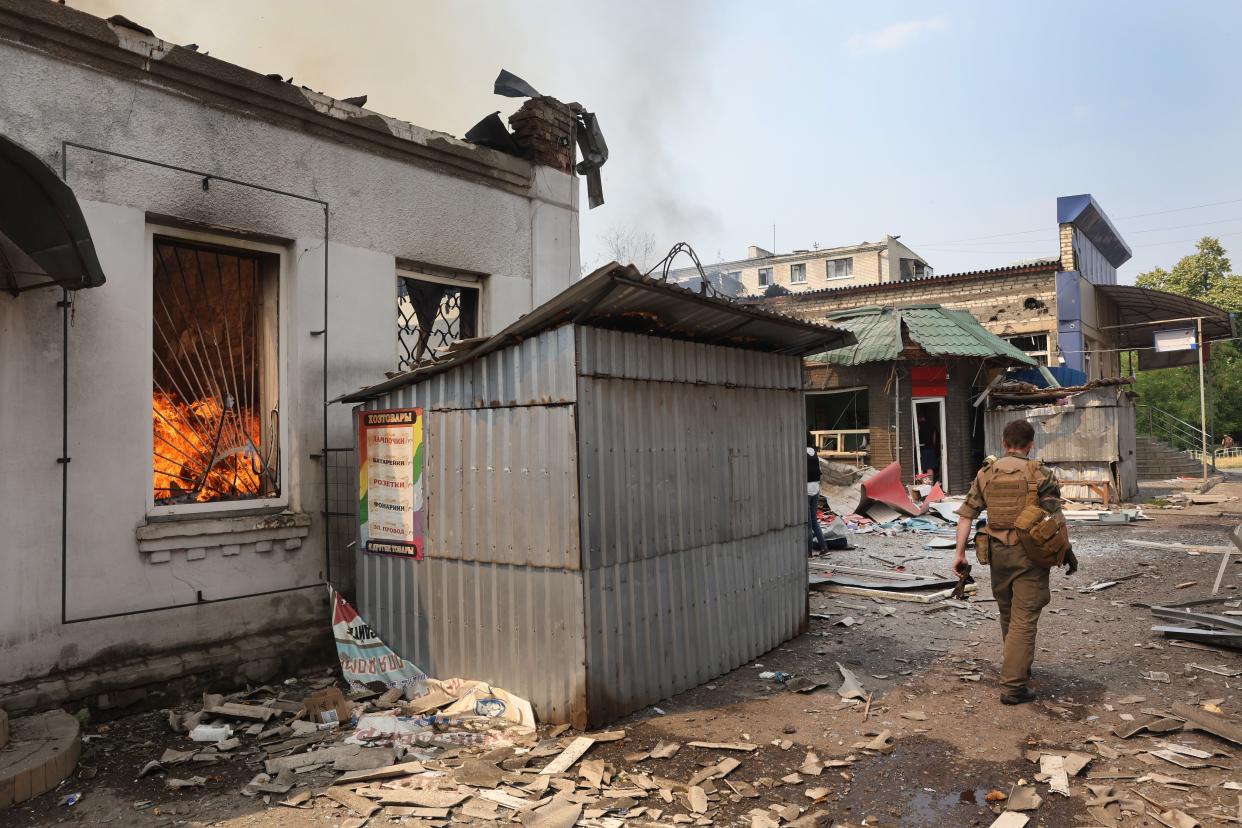 Fire burns at a shopping mall after it was struck by a missile on July 03, 2022 in Sloviansk, Ukraine. The attack was one of many in the city early Sunday afternoon, which targeted residential neighborhoods, destroyed homes and left at least 6 people dead and 15 injured.