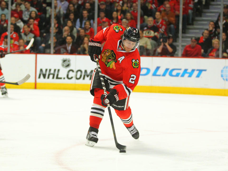 May 2, 2014; Chicago, IL, USA; Chicago Blackhawks defenseman Duncan Keith (2) clears the puck during the second period of game one of the second round of the 2014 Stanley Cup Playoffs against the Minnesota Wild at the United Center. (Dennis Wierzbicki-USA TODAY Sports)