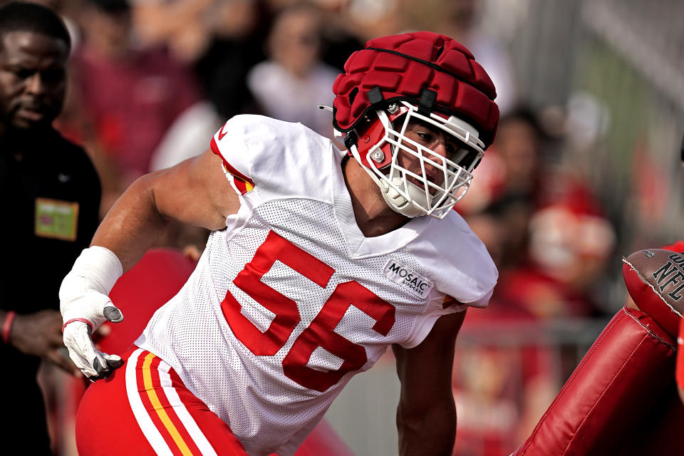 Kansas City Chiefs defensive end George Karlaftis participates in a drill during NFL football training camp Sunday, Aug. 7, 2022, in St. Joseph, Mo. (AP Photo/Charlie Riedel)