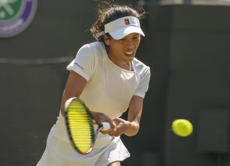 Jul 7, 2018; London, United Kingdom; Su-Wei Hsieh (TAI) in action during her match against Simona Halep (ROU) on day six at the All England Lawn and Croquet Club. Mandatory Credit: Susan Mullane-USA TODAY Sports