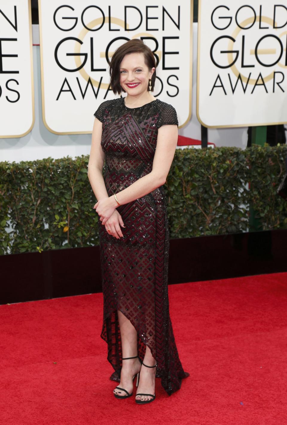 Elizabeth Moss arrives at the 71st annual Golden Globe Awards in Beverly Hills