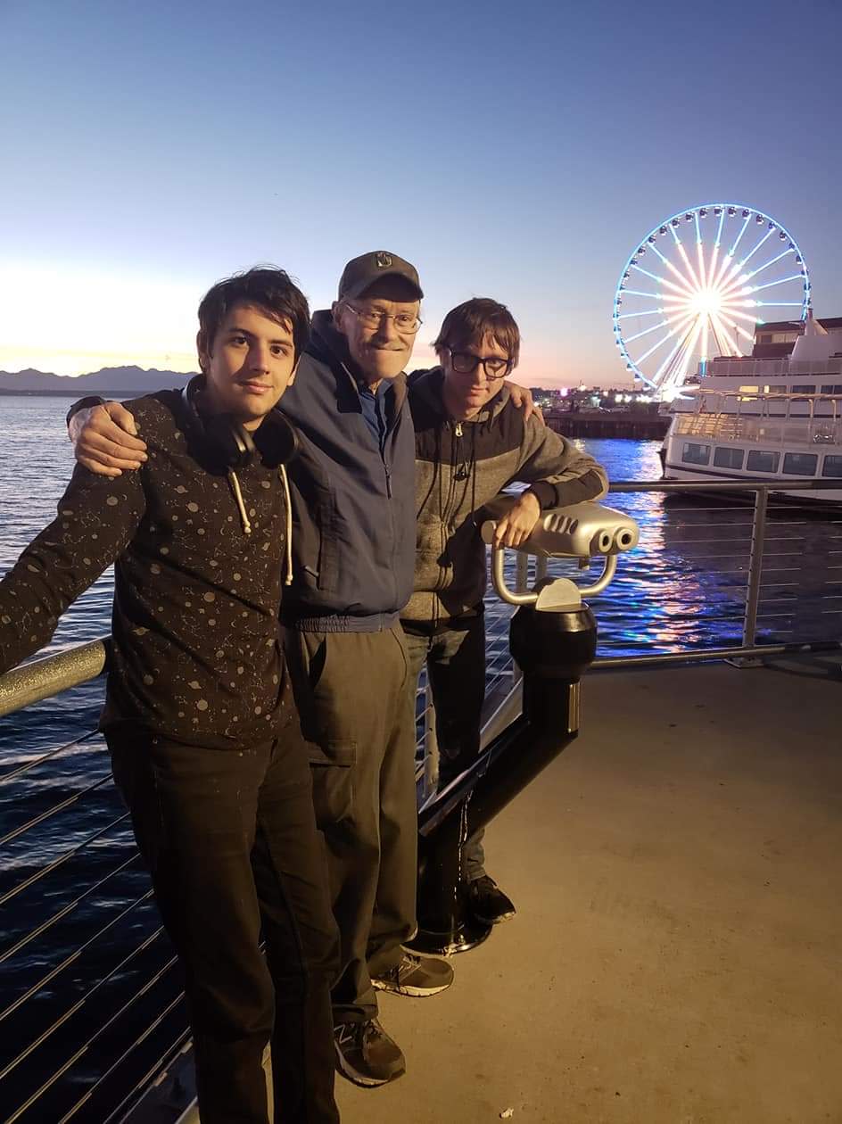 Bob Vermeers, with grandsons Ian Vermeers, left, and Kal-El Tremblay, right, stand on a pier in downtown Seattle. Vermeers, a Kitsap Sun newspaper carrier for the past 16 years, died unexpectedly on Nov. 19 while delivering his route.