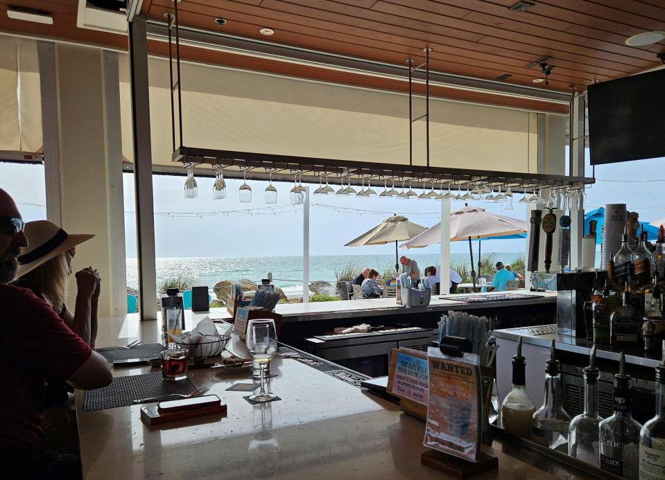 Beach House Waterfront Restaurant is at 200 Gulf Drive N., Bradenton Beach on Anna Maria Island. Its outdoor bar, photographed April 10, 2024, overlooks the beach and the Gulf of Mexico.