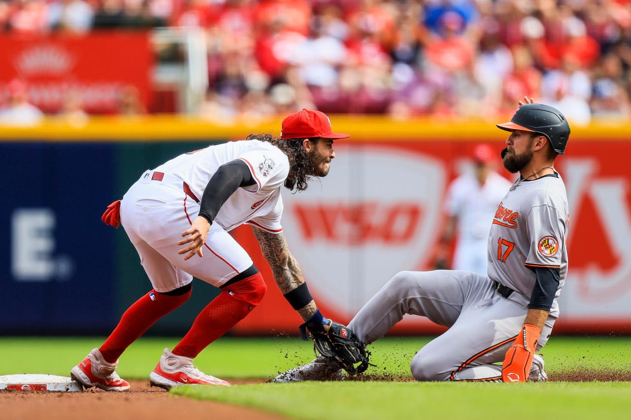 May 5, 2024; Cincinnati, Ohio, USA; Baltimore Orioles outfielder Colton Cowser (17) attempts to steal second against Cincinnati Reds second baseman Jonathan India (6) in the second inning at Great American Ball Park.