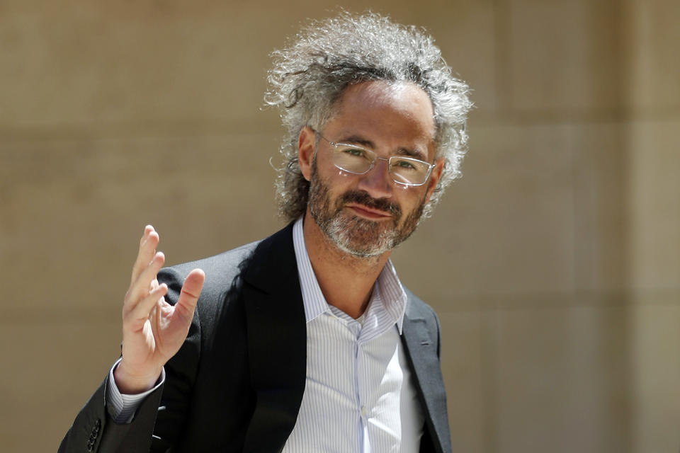 FILE - In this Wednesday, May 15, 2019, file photo, Palantir CEO Alex Karp arrives for the Tech for Good summit in Paris. Palantir Technologies Inc., a data-mining company with deep ties to U.S. intelligence and military agencies, has shed a good deal of its trademark secrecy about its business in filing for a Wall Street stock offering, on Tuesday, Aug. 25, 2020. (AP Photo/Thibault Camus, File)