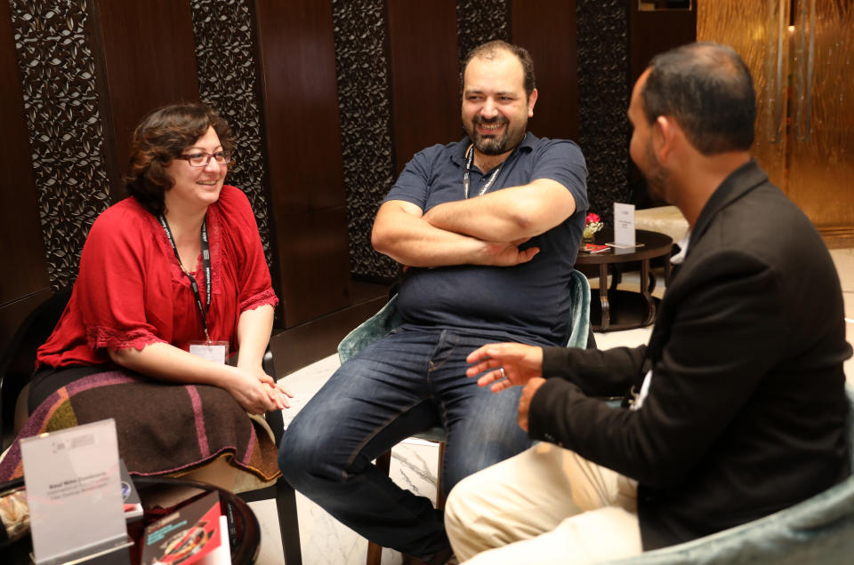 Director Diana El Jeiroudi (L) and producer Orwa Nyrabia (C) meet with IDFA's Raul Nino Zambrano during a one-on-one session to discuss their new project 'Republic of Silence' on day three of Qumra, the third edition of the industry event by the Doha Film Institute dedicated to the development of emerging filmmakers on March 5, 2017 in Doha, Qatar. 